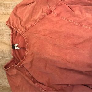 Distressed burnt orange free people top